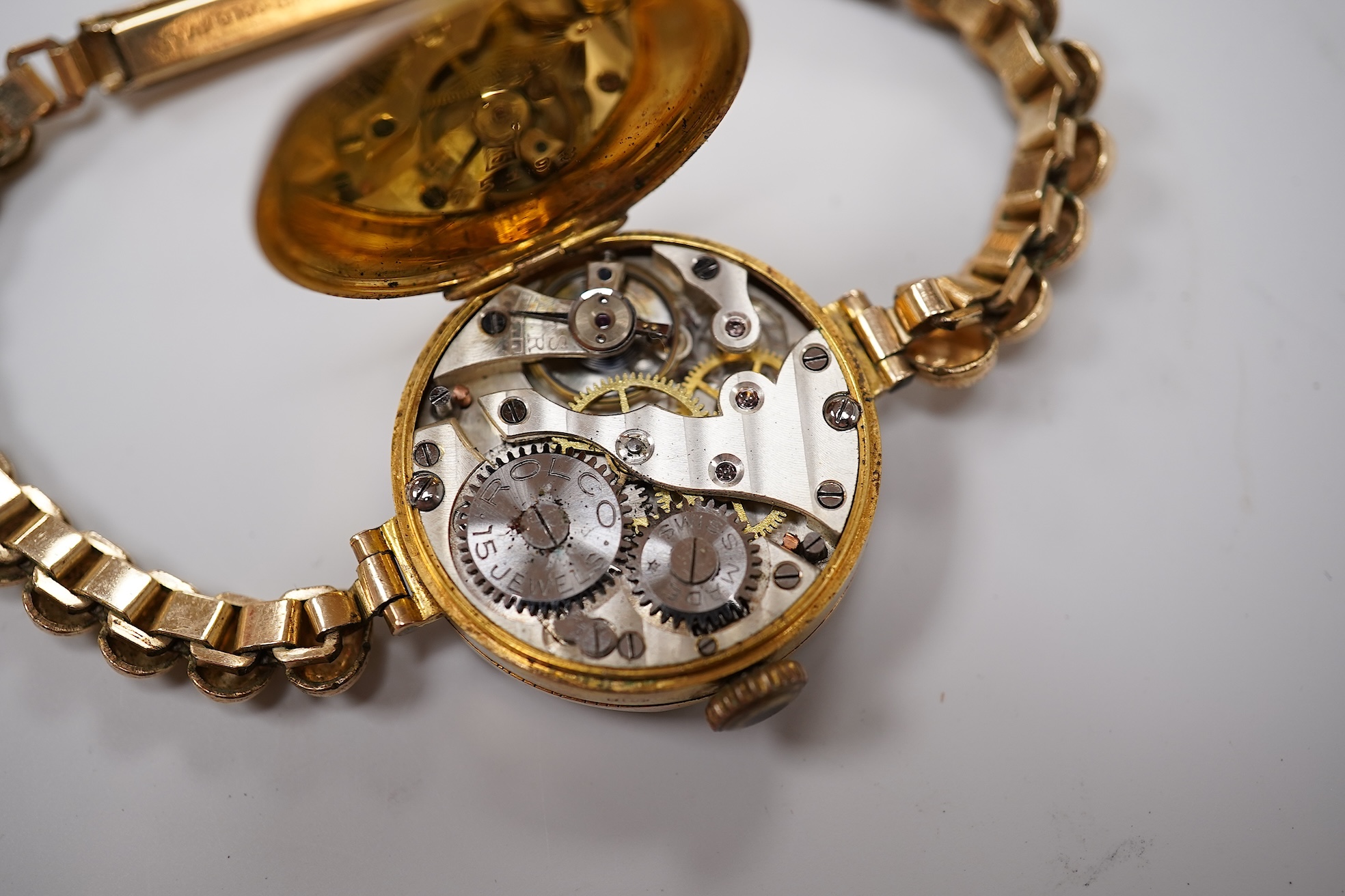 A lady's 9ct Omega manual wind wrist watch, on an associated leather strap, case diameter 20mm, together with a lady's early 20th century 9ct gold Rolco manual wind wrist watch, on a rolled gold bracelet.
